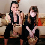 Television Watching Mom and Daughter